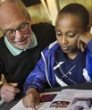 Fred Mosekjær Madsen helping a student with home work